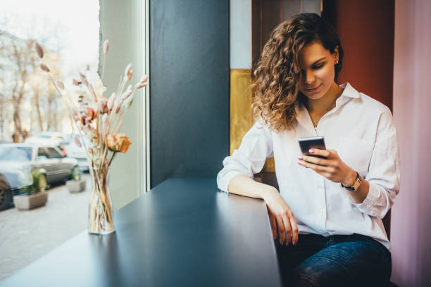 istock Smiling young woman wearing white shirt 1143522378