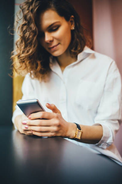 istock Smiling young woman wearing white shirt 1143522383