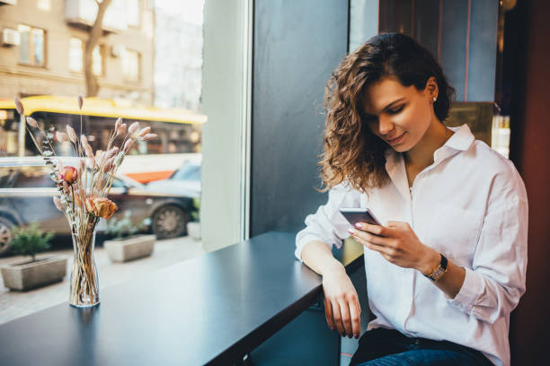 istock Smiling young woman wearing white shirt 1143522384