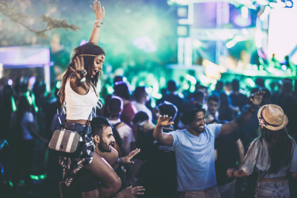 istock Happy friends having fun while dancing on a music festival. 1143523717