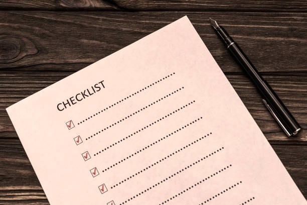 istock cChecklist, fountain pen on wooden table 1143524085