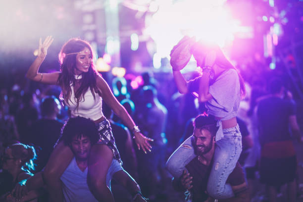istock Young carefree couples having fun on a music concert. 1143524393