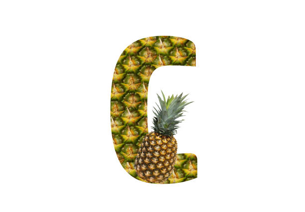 istock Alphabet letter C made from pineapple on a white background. Tropical fruit pineapple diet summer food. 1143524638
