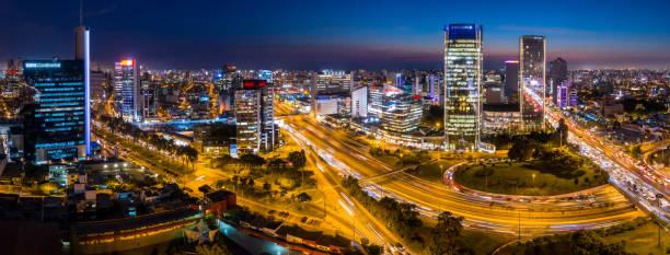 LIMA, PERU: Panoramic view of skyline in San Isidro district at blue time.