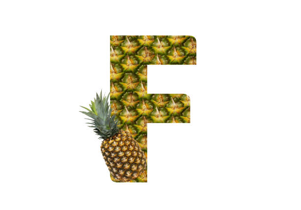 istock Alphabet letter F made from pineapple on a white background. Tropical fruit pineapple diet summer food. 1143525582