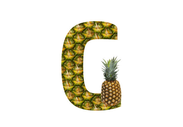 istock Alphabet letter G made from pineapple on a white background. Tropical fruit pineapple diet summer food. 1143525705