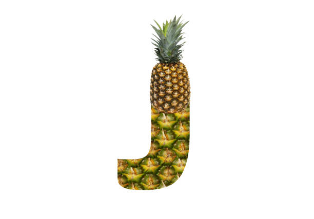 istock Alphabet letter J made from pineapple on a white background. Tropical fruit pineapple diet summer food. 1143526481