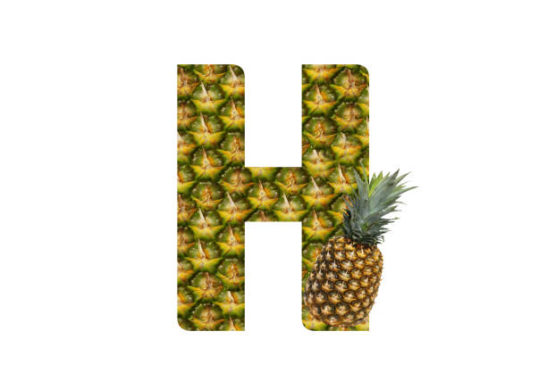 istock Alphabet letter H made from pineapple on a white background. Tropical fruit pineapple diet summer food. 1143526537