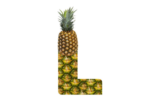 istock Alphabet letter L made from pineapple on a white background. Tropical fruit pineapple diet summer food. 1143526582