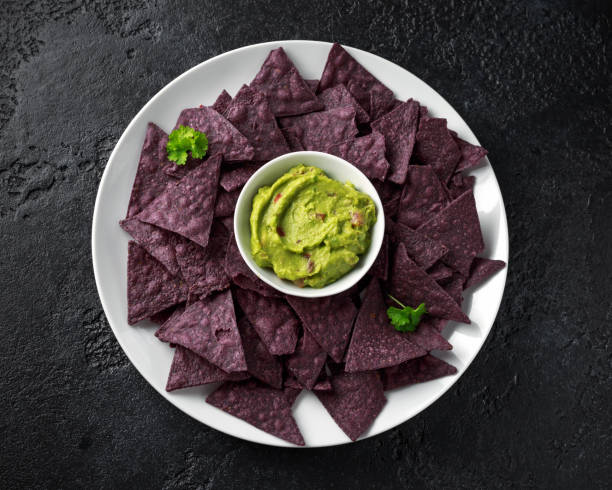 istock Blue corn Organic tortilla chips with Guacamole 1143528978