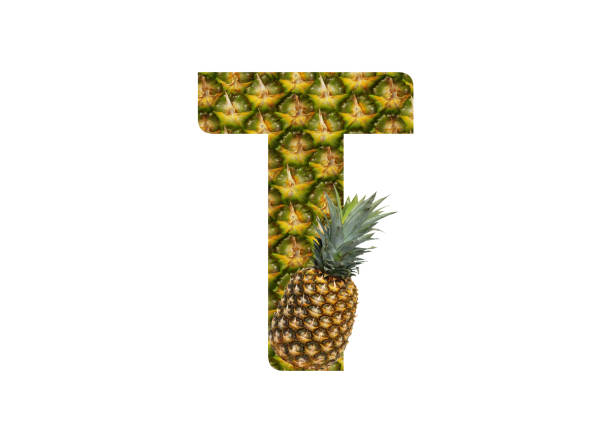 istock Alphabet letter T made from pineapple on a white background. Tropical fruit pineapple diet summer food. 1143528982
