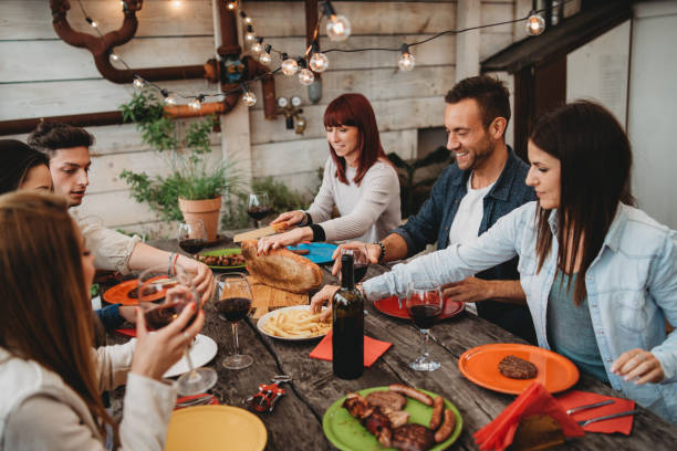 istock Friends having dinner together on the rooftop at home 1143528991