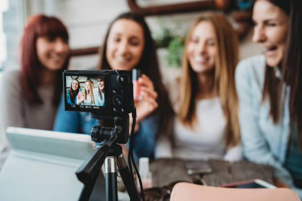 istock Four friends doing a vlog video together 1143529092