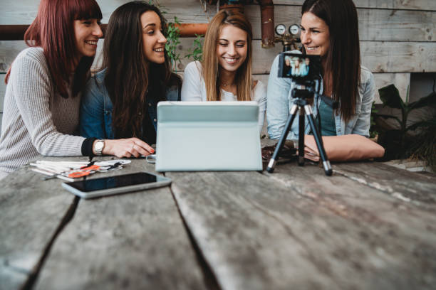 istock Four friends doing a vlog video together 1143529093