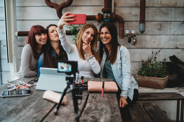 istock Four friends doing a vlog video together 1143529101
