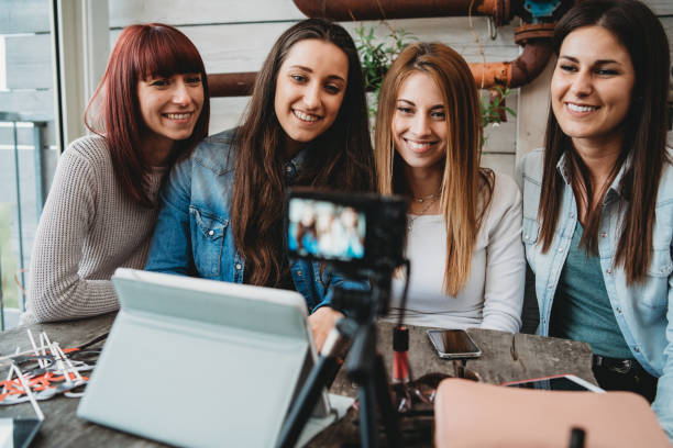 istock Four friends doing a vlog video together 1143529107
