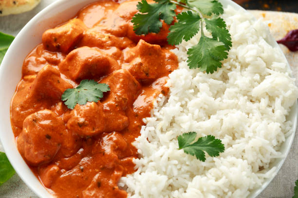 istock Chicken tikka masala curry with rice and naan bread. close up 1143530018