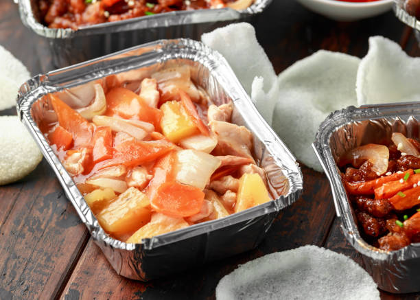 istock Chinese takeaway food. Crispy shredded beef, Chicken pineapple, chilli dip and prawn crackers 1143530289
