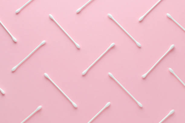 istock white cotton swabs on pink background, abstract pattern 1143532715