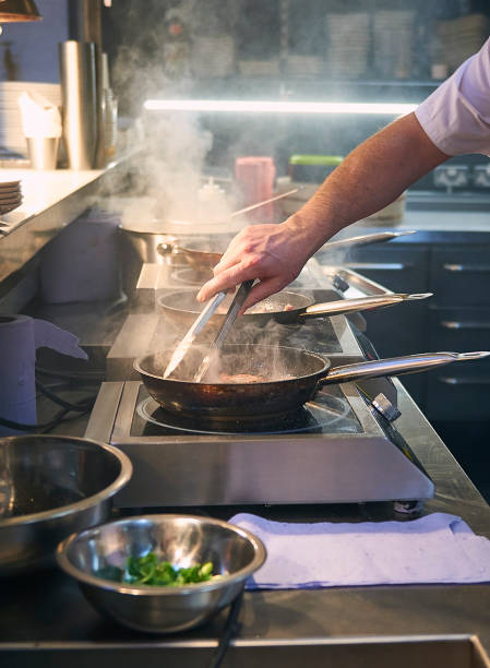 Chef cooking steak stock photo