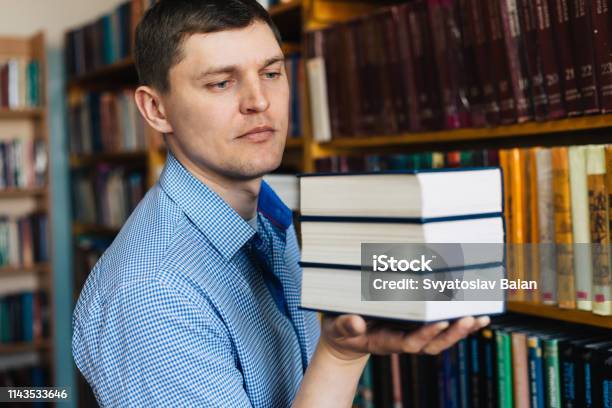 Stack Of Books Lying On The Palm Stock Photo - Download Image Now - Advice, Angle, Arm