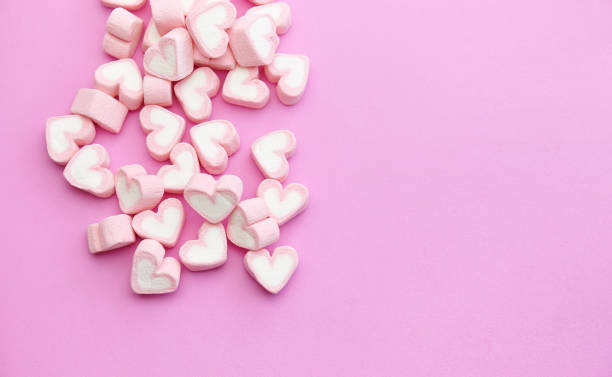 istock Flat lay template design top view pink marshmallows on sweet background with copy space 1143533715