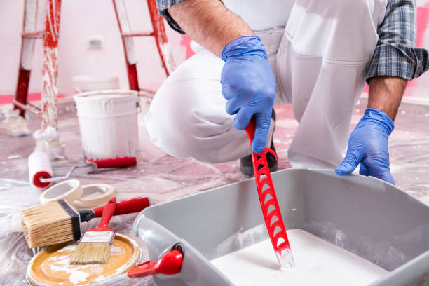 istock House painter worker at work in the construction site. Building. 1143535956