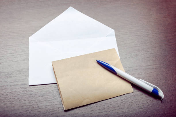 istock Photo of blank envelope on a  wooden background 1143539491
