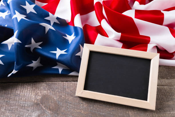 istock Blank chalk board with American Flag 1143540735