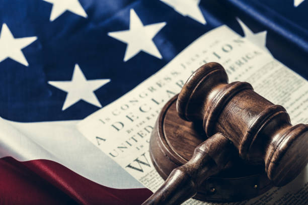 istock Wooden gavel and USA flag 1143540949