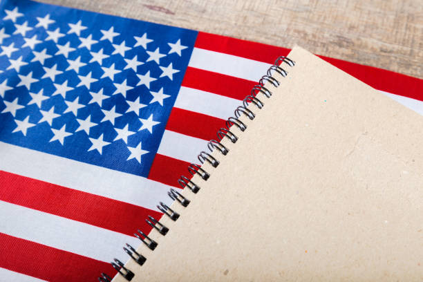 istock open book on American flag 1143541512