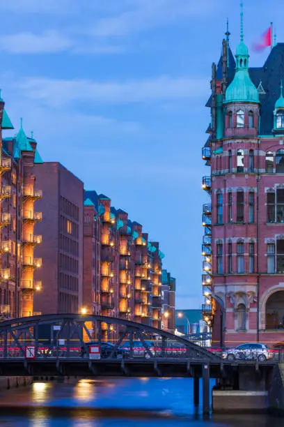 illuminated historic buildings in Hamburg during blue hour in the evening