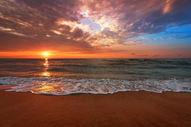istock Beautiful ocean landscape with vibrant sunset. 1143546336