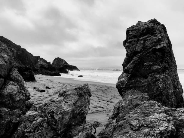 istock Rocky shoreline under cloudy skies 1143546657