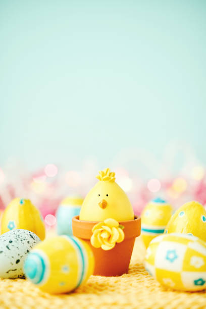 istock Easter background with Easter eggs and little chick in flowerpot 1143546724