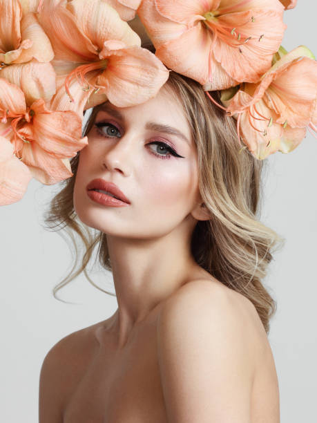 istock Beautiful young woman with flowers 1143547667