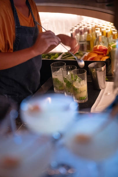 Bartender preparing mojitos