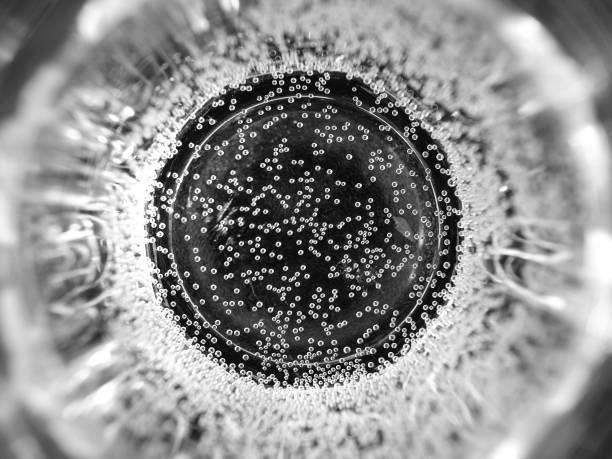 Water glass with bubbles from above