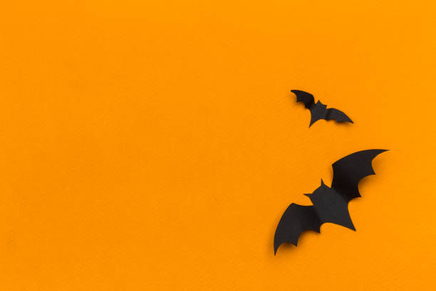 istock halloween and decoration concept - paper bats flying 1143549391