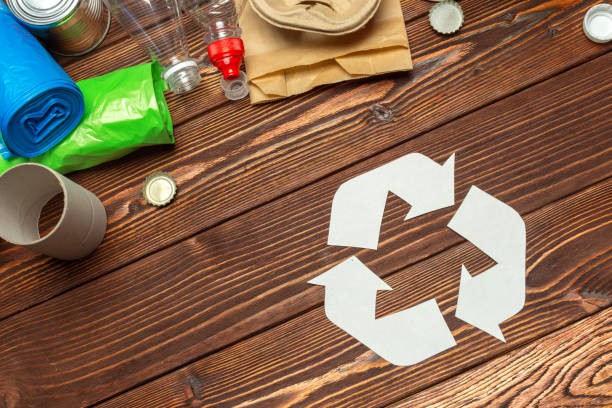 istock Eco concept with recycling symbol on table background top view 1143550265