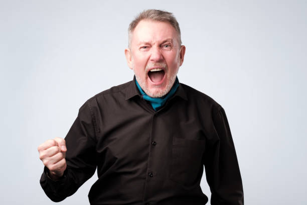 istock Angry shocked man screaming, isolated on white background. 1143550497