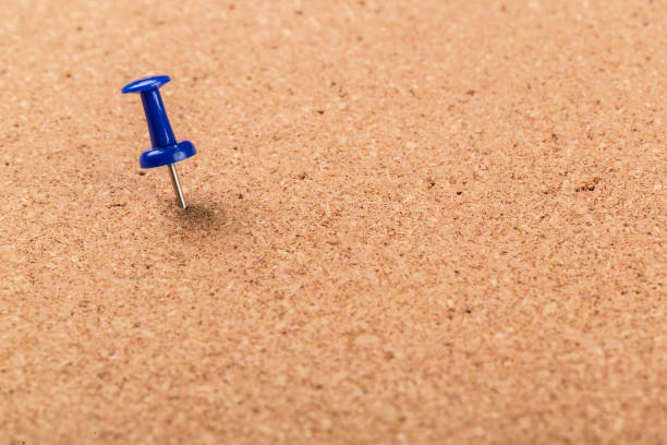 istock Pin board texture for background and colorful pins 1143550587