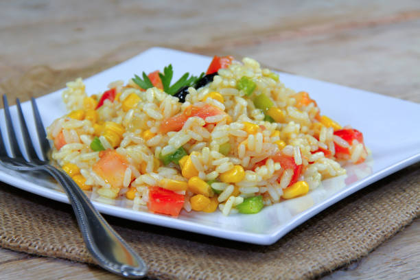 plate of cold rice salad and vegetables