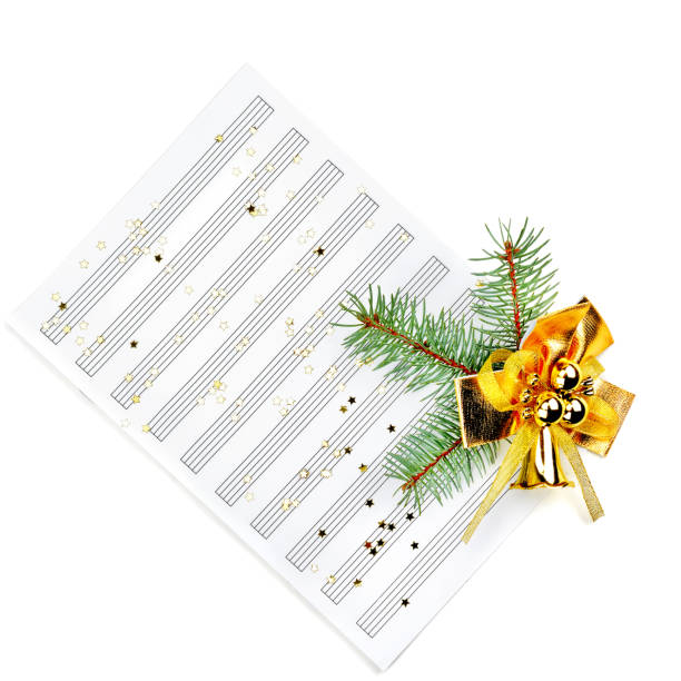 istock Christmas decorations and music sheet isolated on white background 1143554380