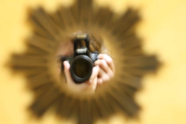 Two professional dslr cameras are lying on a white table in a modern apartment, ready for a photoshoot