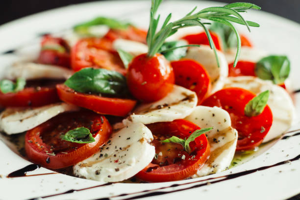 istock Appetizer with feta and tomatoes on dish 1143558634