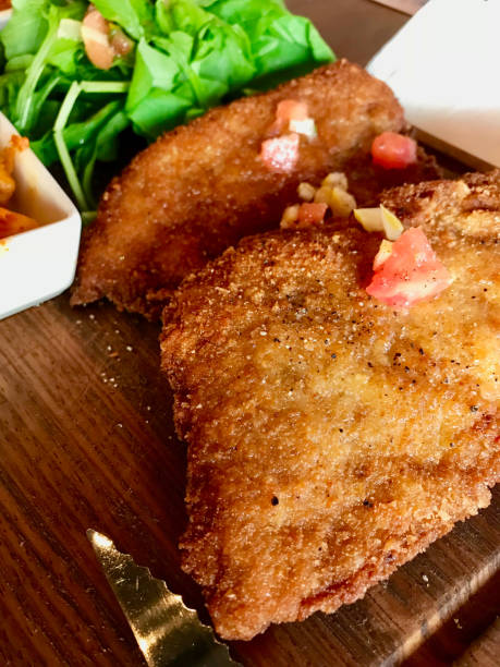 istock Juicy Schnitzel with Lemon Sauce and Tomatoes. 1143560241