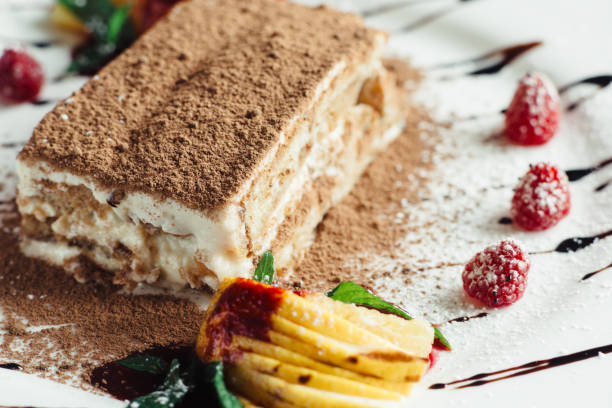 istock Tiramisu cake with cognac and raspberries 1143560409