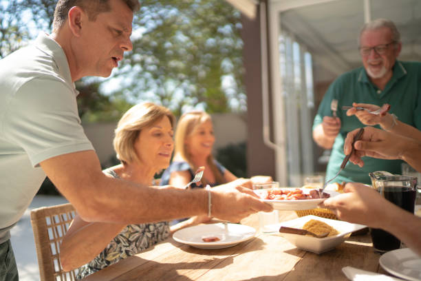 istock Barbecue host serving meat to the guests 1143561184