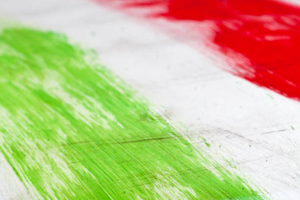 Italy. Italian flag painted with three vertical brush strokes on white background.